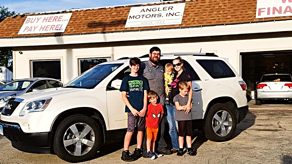 Happy customer family at Angler Motors